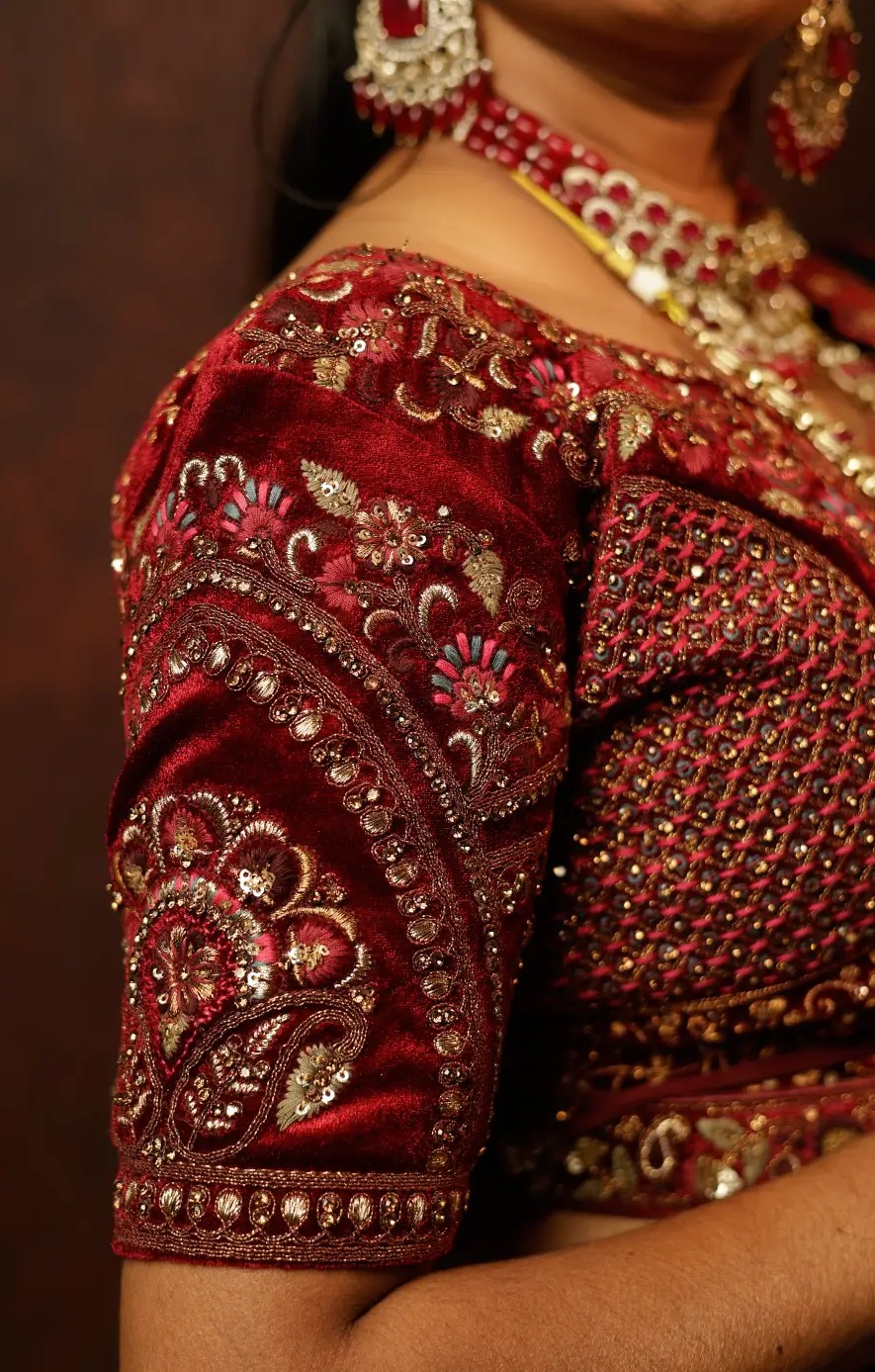 Halter neck blouse in brocade fabric adorned with pearls, ideal for modern brides.